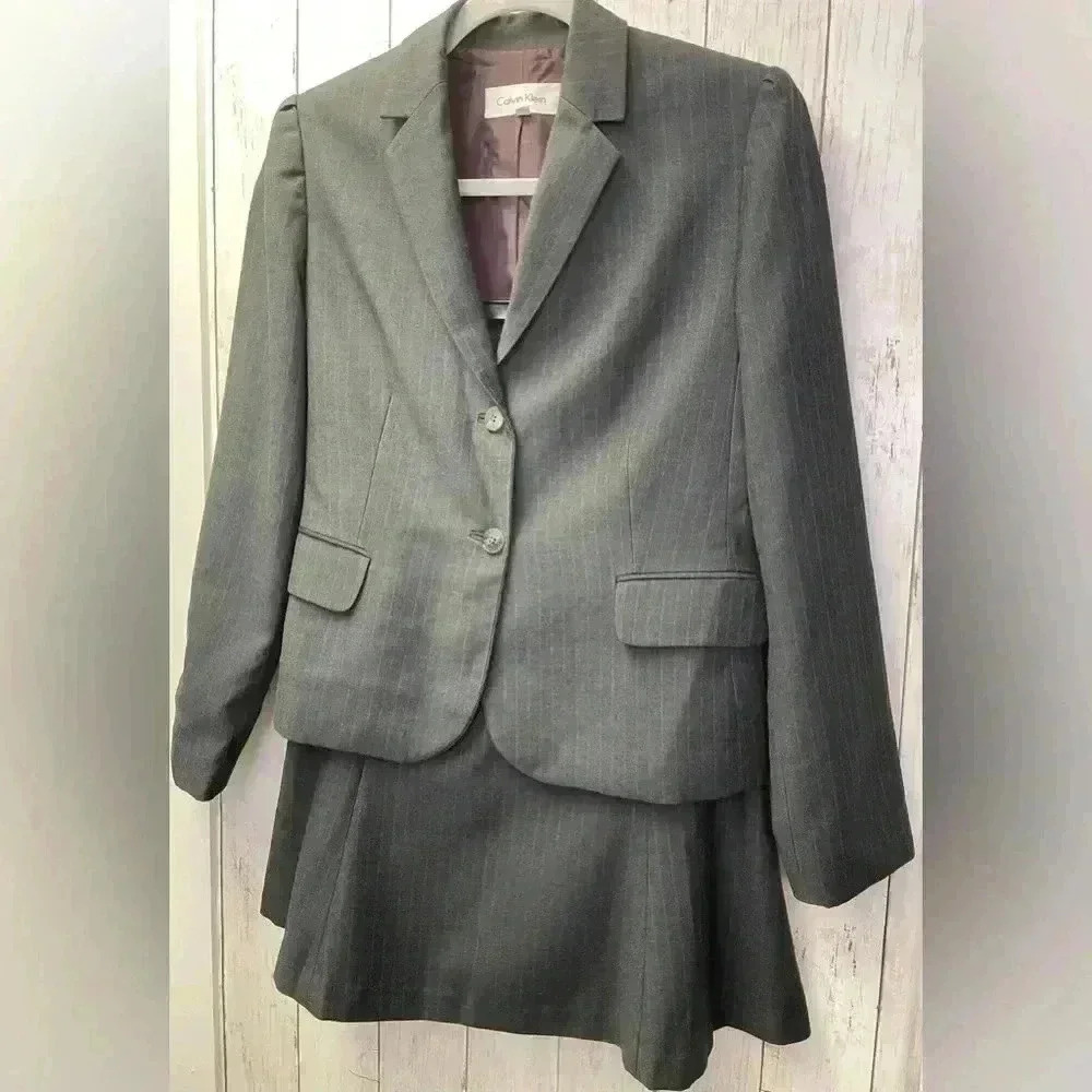 Calvin Klein skirt suit size 8p Color Black with pin stripe pattern/Work/Career